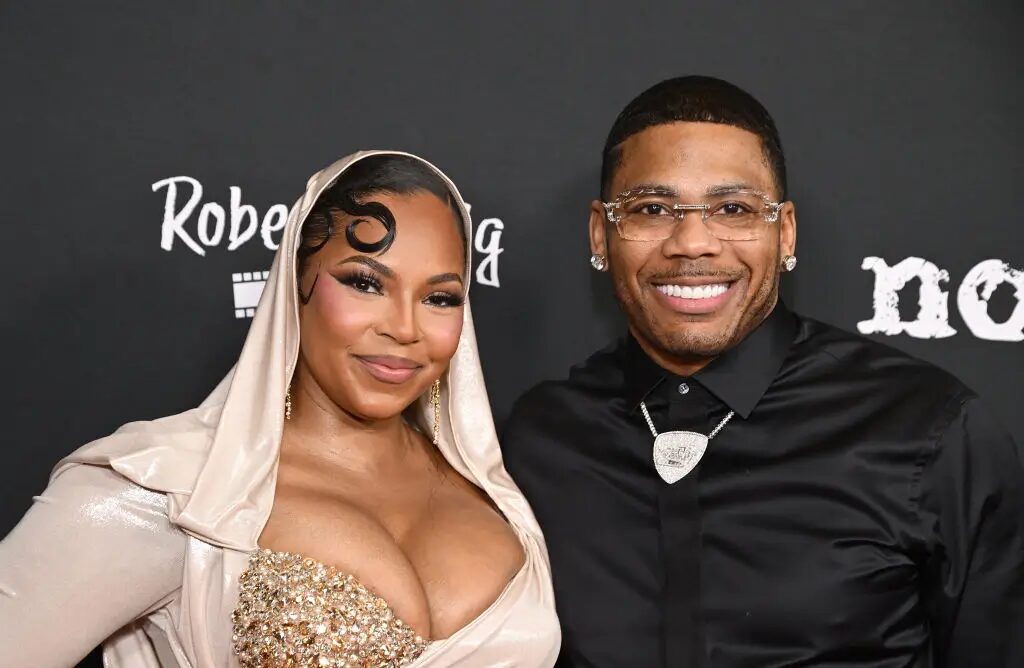 ‘He’s Still Canceled’: Fans Accuse Ashanti of Trying to ‘Ease’ Husband Nelly Back Into Their ‘Good Graces’ After Being Canceled Over Controversial Trump Performance 